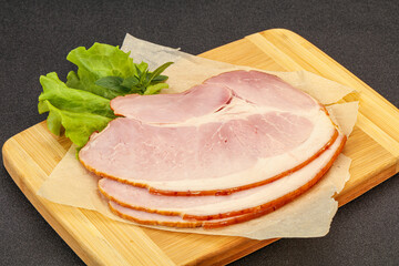 Sliced pork belly over board