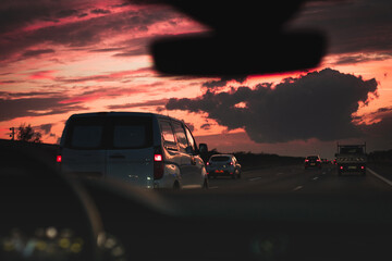 Fototapeta na wymiar sunset road traffic with clouds