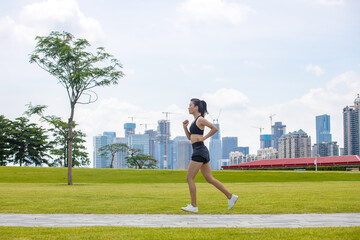 Young women run for fitness in the morning