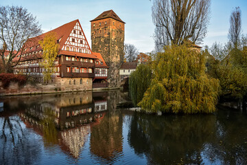 View of Wine Vault or Weinstadel, water tower and Hangman Bridge or Henkersteg over Pegnitz in Nuremberg, German.