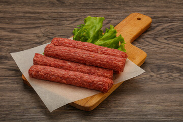 Raw beef sausages with spices