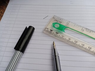 pens and plastic ruler
