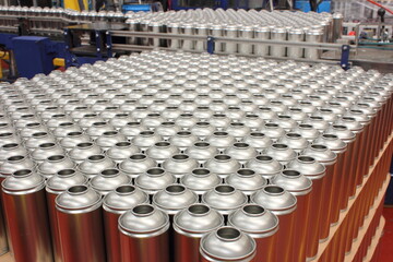 Silver aerosol cans in aerosol manufacturing business - obrazy, fototapety, plakaty
