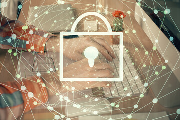 Double exposure of lock icon with man working on computer on background. Concept of network security.