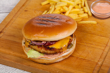 Burger with chicken, cheese and red onion