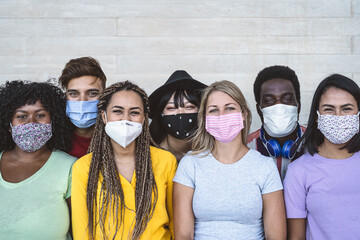 Group young people wearing face mask for preventing corona virus outbreak - Millennial friends with different age and culture portrait - Coronavirus disease and youth multi ethnic concept - obrazy, fototapety, plakaty