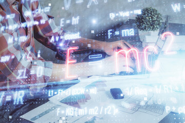 Science formula hologram with man working on computer on background. Education concept. Double exposure.