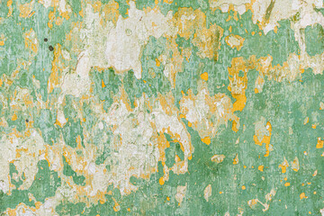 Old wall with peeling paint green