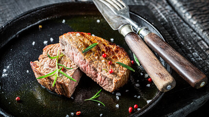 Steak with fresh herbs and salt ready to eat