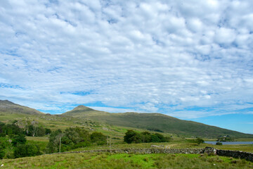 Obraz premium Wales the Snowdonia National Park on a bright summers day. Dramatic hills set against a blue summers sky.