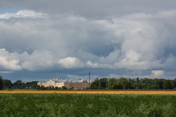 Fototapeta na wymiar rundale castle from afar with storm clouds