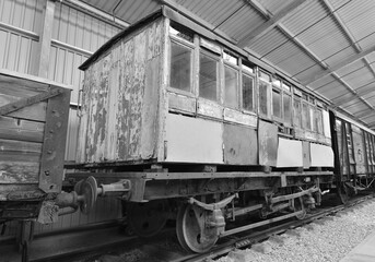 Naklejka na ściany i meble A Rotten railway carriage in a warehouse.