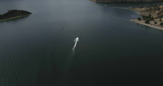 People are playing a jet ski in the sea. Aerial view. Aerial View 
