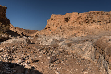 Fototapeta premium Crescents Spring round trail in Ramon Crater, at its eastern end, near the small town of Mitzpe Ramon, Ramon Nature reserve, Negev desert, Israel.