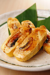 A Plate Of Japanese Style Fried Eel Egg Roll