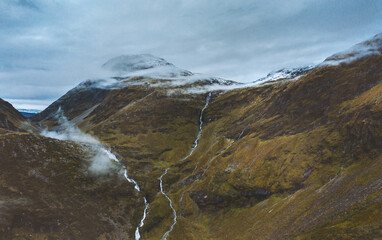 Aerial view foggy mountains landscape in Norway travel scandinavian nature drone scenery from above