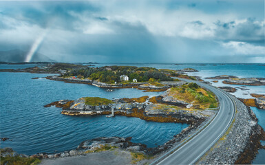 Atlantic ocean road landscape in Norway aerial view stormy weather nature clouds with rainbow drone scenery scandinavian trip travel beautiful destinations