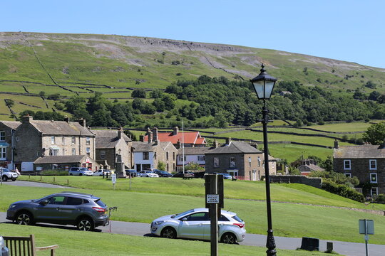 A view of the village green in the rural village of Reeth  in the Yorkshire Dales, England, UK.