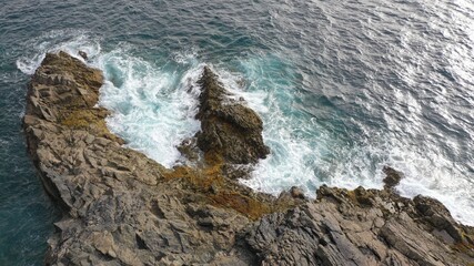 mighty ocean spitting out the cliffs