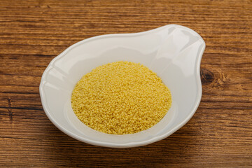Raw cous cous heap in the bowl