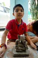 Pune, India, 25 August 1019. Children classes for making Ganesh/Ganpati idol or murti, Ganpati making workshop