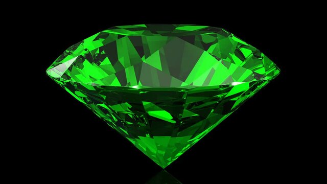 Green emerald rotating on a black background. Looping animation, 4k.