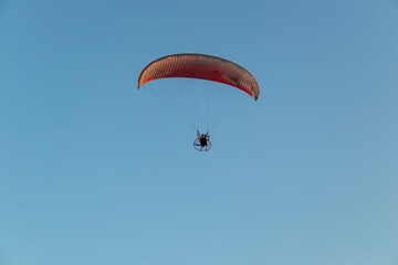 paragliding in the blue sky