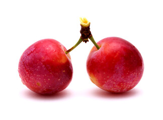 Small cherry plums, isolated on white background