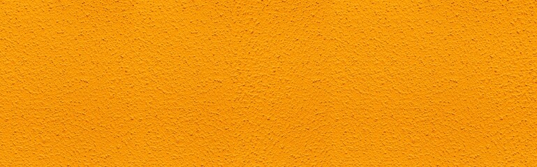 Panorama of Patterned cement wall Vintage yellow painted texture and background