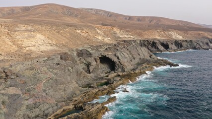 mighty ocean spitting out the cliffs