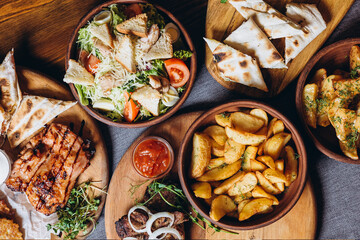 delicious European and Slavic cuisine on the big table waiting for guests. table with food, top view