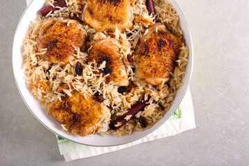 Chicken thighs with cardamom spicy rice