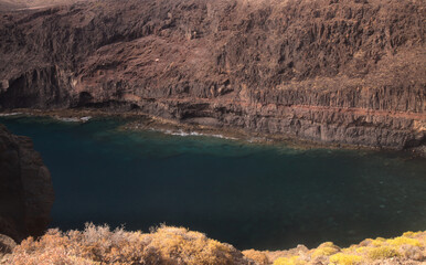 Gran Canaria, steep eroded coast line of Agaete municipality, path to Playa del Juncal beach 