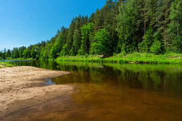 Obraz premium Wild river with reflections