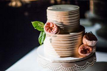 unique wedding cake in harsh light with piece cut out