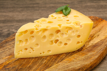 Maasdam cheese - yellow triangle with holes