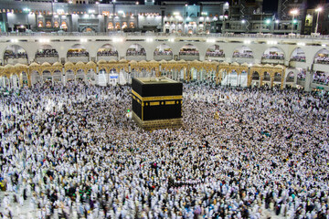 Holy Kaaba. Crowd of muslims walking around Kaaba for Tawaf during Hajj.