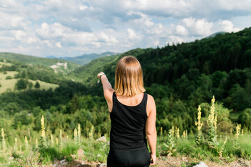 Young woman enjoying the view of a beautiful mountain range