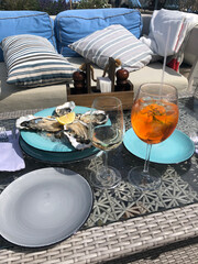 Oysters, wine and aperol spritz on the summer veranda.