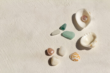 seashells, pearls, stones, colored glass on a white background