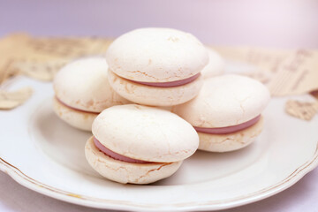 White macaroons on a plate