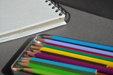 Colored pencils and a notebook