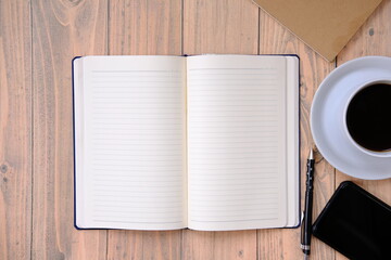 a cup of coffee on wood table and space for text