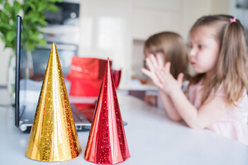Red, yellow holiday hat. Kids virtual birthday party. Celebration of holiday at home on isolation....