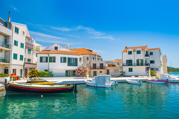 Fototapeta na wymiar Boats in marina in old town of Pirovac on Adriatic coastline in Croatia