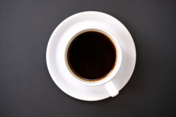 Obraz na płótnie Canvas cup of coffee on black background