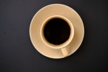 Top view coffee cup and coffee beans on old wood table background, space for text