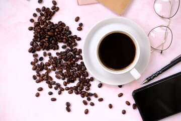 Top view coffee cup and coffee beans on old wood table background, space for text