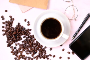 Top view coffee cup and coffee beans on old wood table background, space for text