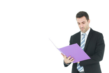 Handsome Caucasian man in black suit holding violet document file and serious in work isolated on white background.